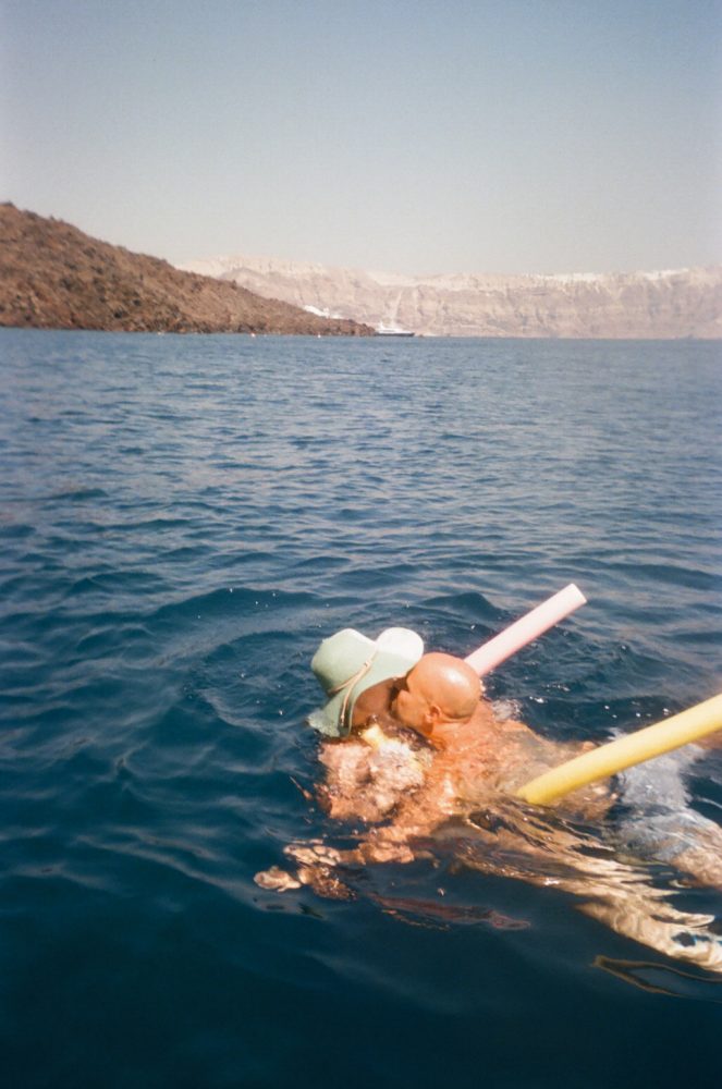 35mm film photographer at destination wedding in Santorini