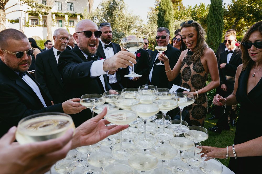 guests take a glass of champagne from the tower at Villa Eva wedding in Ravello